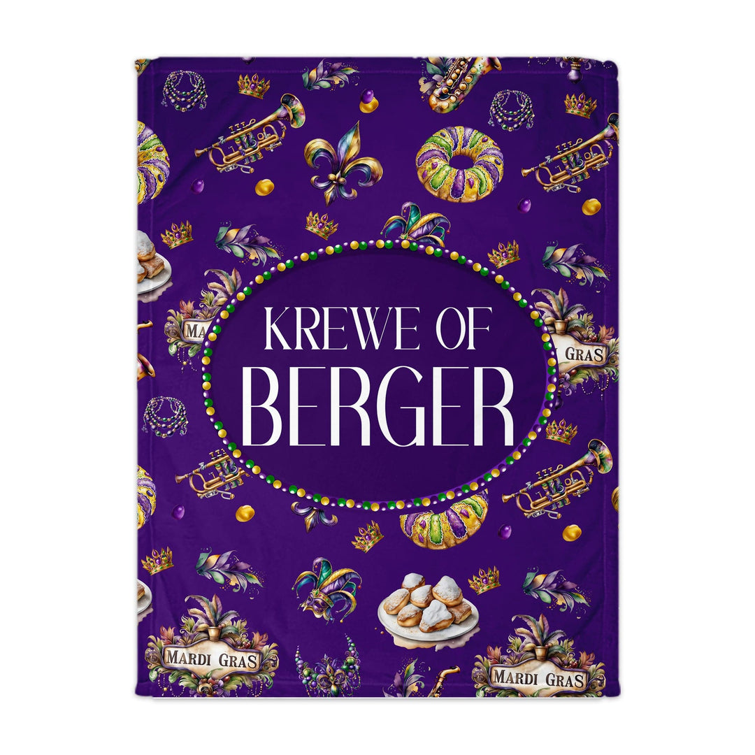 Purple Mardi Gras-themed blanket with 'Krewe of Berger' text and festive decorations.