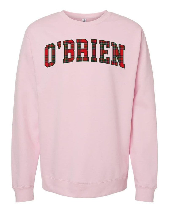 O'BRIEN in classic tartan collegiate letters on a light pink sweatshirt